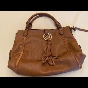 Tan shoulder purse with two pockets and one zipper pocket inside